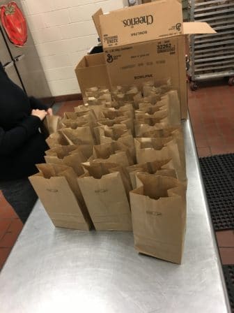 Lunches waiting to be distributed to Portland students. Photo courtesy Ailish Dennigan, Food Services Team Leader at East End Community School