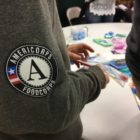 A FoodCorps member proudly wears the AmeriCorps patch while serving on MLK Day 2017