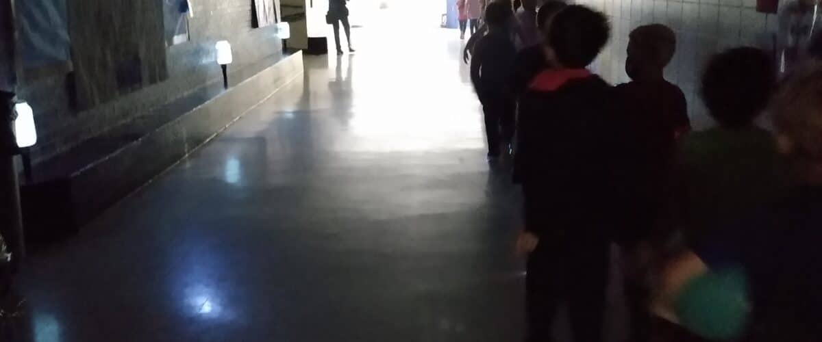 A darkened hallway of a school during a blackout