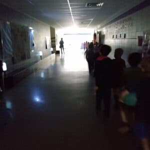 A darkened hallway of a school during a blackout