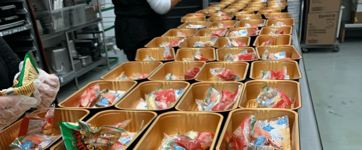 School nutrition workers prepare meals for students during the pandemic